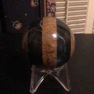 Striped stone sphere in earthy browns and blacks